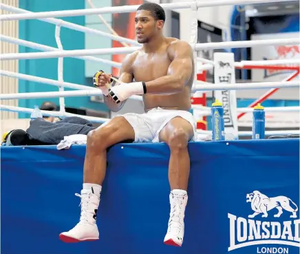  ?? Picture / AP ?? Anthony Joshua works out ahead of his fight with Joseph Parker.