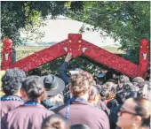  ?? MARK JEPHSON ?? Crowds file through the gateway at Turangawae­wae to pay their respects.