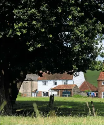  ??  ?? FROM HOP KILN TO HOME
Most oasts, like these near Small Hythe, have been converted into dwellings, retaining their white cowls.