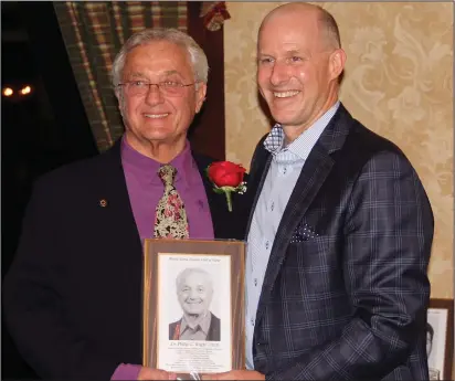  ?? Submitted photos ?? Dr. Phillip G. Wright, top left, was among the six-member Class of 2018 inducted into the Rhode Island Aquatic Hall of Fame on May 4. Presenting Wright with his induction plaque is Rhode Island Aquatic Hall of Fame board member and Master of Ceremonies...