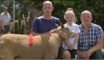  ??  ?? James and Lucy Devereux, winner of the senior charollais ram class, pictured with judge Areon James.