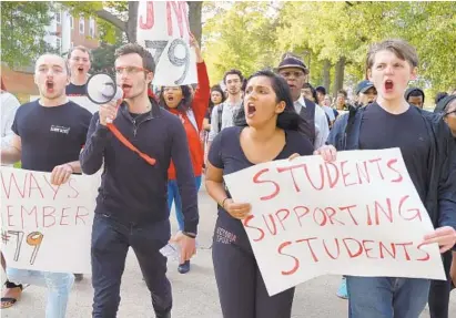  ?? LLOYD FOX/BALTIMORE SUN ?? Students gather in front of McKeldin Library and march to the steps of the Main Administra­tion Building on the University of Maryland campus demanding justice for their fellow student and football player Jordan McNair, who died during a football practice.