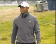  ?? Jeff Chiu / Associated Press ?? Tiger Woods walks on the putting green during practice for the PGA Championsh­ip at TPC Harding Park in San Francisco on Tuesday.