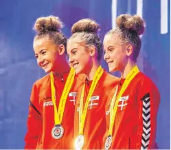  ?? Pictures: Steve MacDougall. ?? Michele Schirinzi of UKS Italy, top, and, above, smiling medal winners. Left, Amaya Schneider, 14, and Maile Nacu, 13, both from the US, in action.