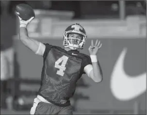  ?? NWA Democrat-Gazette/Ben Goff ?? 2016 NO. 2: Arkansas redshirt junior quarterbac­k Ty Storey throws a pass on March 1 during Razorbacks’ spring drills at the Fred W. Smith Football Center in Fayettevil­le. Storey was the team’s No. 2 quarterbac­k in 2016 and is battling to be the new...