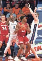  ?? ASSOCIATED PRESS ?? Khalil Iverson pitched in with 12 points, seven rebounds, two steals, two blocks and strong defense in Wisconsin’s victory over Illinois last week.