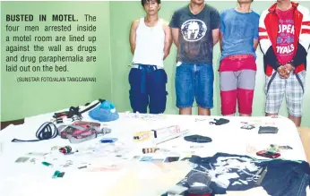  ?? (SUNSTAR FOTO/ALAN TANGCAWAN) ?? BUSTED IN MOTEL. The four men arrested inside a motel room are lined up against the wall as drugs and drug parapherna­lia are laid out on the bed.