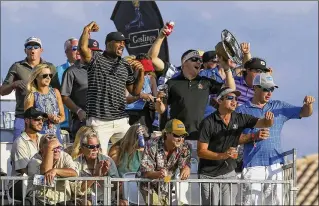  ?? BILL INGRAM / THE PALM BEACH POST ?? Fans cheer Rickie Fowler at the 16th green during the third round of the 2017 Honda Classic. Booze often flows when crowds gather in optimal viewing areas of the 16th and 17th holes.
