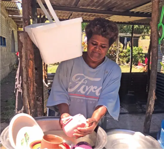  ?? Photo: Kelera Sovasiga ?? Sera Lomawai makes sure water is used wisely at home in Navatu, Ra.