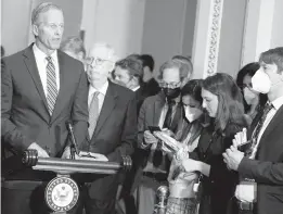  ?? MARIAM ZUHAIB/AP ?? Senate Minority Leader Mitch McConnell of Ky., second from left, listens as Sen. John Thune, R-S.D., speaks during a news conference on April 26 in Washington.