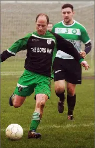  ??  ?? Kyle Murphy of Cloughbawn has time on his side as John Kavanagh (Gorey Celtic) looks on in their Division 1 clash (left), while William Murphy prepares to start another Cloughbawn attack with Kenneth Byrne breathing down his neck (right).