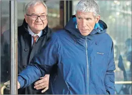  ?? [STEVEN SENNE/THE ASSOCIATED PRESS] ?? William “Rick” Singer, right, founder of the Edge College &amp; Career Network of Newport Beach, Calif., exits federal court in Boston on Tuesday after pleading guilty to being a ringleader in a nationwide college admissions bribery scandal. Singer took bribes from wealthy parents to get their children in elite schools.