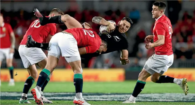  ?? PHOTO: GETTY IMAGES ?? All Blacks second five-eighth Sonny Bill Williams is brought back down to earth by Lions backs Ben Te’o and Owen Farrell, left, during the first test.
