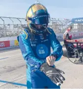  ?? JENNA FRYER/AP ?? Jimmie Johnson fractured his hand in a crash on Friday and was fitted with a carbon fiber splint that he tested in Saturday’s practice.