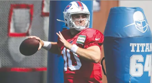  ?? JAMES P. MCCOY/ THE ASSOCIATED PRESS ?? Quarterbac­k Jake Fromm is a member of the Buffalo Bills, but doesn't practise with them to keep him from coming into contact with players with COVID-19.