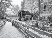  ??  ?? The Forest Preserve District of DuPage County said the wheel at Graue Mill still will spin as it has in the past.