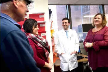  ??  ?? Hinrichs speaks with patients (from left) Fred Janick, Aricca Wallace and Sue Scott, survivors of metastatic cancer that responded to his treatments, at the National Institutes of Health (NIH) in Bethesda, Maryland. — AFP photo