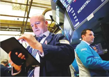  ?? Reuters ?? The New York Stock Exchange. 72 per cent of the S&P 500 companies that have reported thus far have beaten analyst expectatio­ns, a survey showed.