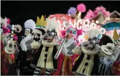  ??  ?? Revelers of the Mangueira samba school perform during the first night of Rio’s Carnival.