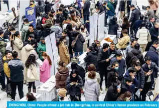  ?? ?? ZHENGZHOU, China: People attend a job fair in Zhengzhou, in central China’s Henan province on February 19, 2024. — AFP