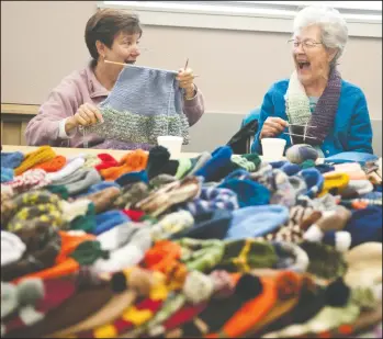  ?? BEA AHBECK/NEWS-SENTINEL ?? New member Darien Provence, of Acampo, and Pat Reynolds, of Lodi, chat and laugh as they knit as members of the Loel Center Knitting Group meet to work on knitting hats for veterans in a Christmas Gift Program, which they presented to the American...