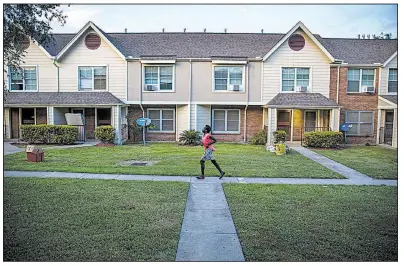  ?? AP/Houston Chronicle/MICHAEL CIAGLO ?? At Clayton Homes in Houston, shown last month, residents displaced by Hurricane Harvey were told they must pay rent for apartments that were unlivable or lose their subsidies for public housing.