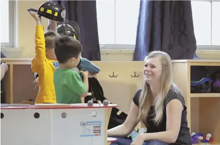  ?? APPHOTOS ?? ‘ZERO TRANSPAREN­CY’: Kids and caregiver, above, at a Seattle day care. Tricia and Steve Schalekamp, top, with sons Evan and Alex, paid at least $500 in nonrefunda­ble waitlist fees for preschool for Evan without getting one call back.