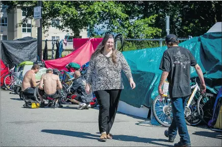  ?? RIC ERNST/PNG ?? Dr. Liz Zubek advocates for the homeless in a camp recently set up on Cliff Avenue in Maple Ridge. The city has said it intends to reveal the full scope of a task force’s homeless plan next Thursday.