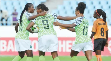  ??  ?? Scorer of Super Falcons second goal, Francisca Ordega (2nd right) being congratula­ted by team mates. Super Falcons whipped the She-Polopolo of Zambia 4-0 yesterday in Cape Coast.