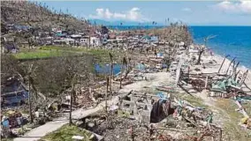  ?? (Foto EPA) ?? Rumah penduduk di pesisir pantai musnah dilanda Taufan Rai di Kampung Punta Bilar, Selatan Filipina.