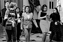  ?? CHIP SOMODEVILL­A/GETTY ?? Reporters question House Speaker Nancy Pelosi as she exits the chamber Friday.