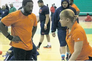  ?? CONTRIBUTE­D ?? This file photo shows Nadia Alexander-Pompey talking to a fellow coach.