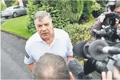  ??  ?? Sam Allardyce speaks to the press outside his home in Bolton. — AFP photo