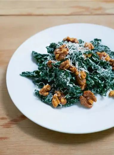  ??  ?? Clockwise from left: the salad takes on a seasonal slant with sweet walnuts; the ingredient­s ready to be quickly combined; separating yolks from the egg whites; Norman takes the crunchy candied walnuts from the oven to cool after 15mins baking