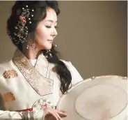 ??  ?? Cheolhyeon­geum (steel-stringed zither) and percussion player Yu Kyung-hwa