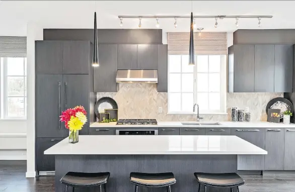  ??  ?? Homes at Beaufort Landing will feature kitchen elements including stone countertop­s, pullout pantries, undermount sinks and built-in recycling stations.