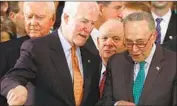  ?? Jonathan Ernst EPA/Shuttersto­ck ?? SEN. JOHN CORNYN (R-Texas), left, with Sen. Schumer, right, said it was unclear whether Trump would sign a bill that added no funding for a wall.