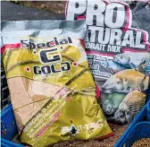  ??  ?? Mark fills his feeders with a mix of Bait-Tech Pro Natural Dark and Super G Gold groundbait