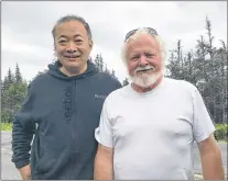  ?? HUANG FAMILY PHOTO ?? John Huang (left) and Gordon Collins.