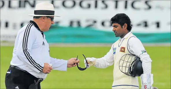  ?? Picture: GALLO IMAGES ?? GIVE AND TAKE: Umpire Ian Howell, left, carries out his umpire duties for Sri Lanka’s Kushal Silva during day two of a tour match between a South Africa Invitation­al side and Sri Lanka at Willowmoor­e Park in Benoni in 2011