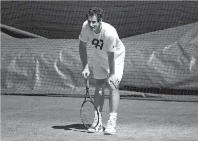  ?? Associated Press ?? Britain's Andy Murray rests between shots Sunday during a practice session ahead of the Wimbledon Tennis Championsh­ips in London.