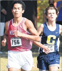  ?? JASON SCHMITT — FOR MEDIANEWS GROUP ?? Milford senior Kazuma Bowring (left) and Clarkston’s junior Andrew Sesti pace each other during Friday’s Oakland County Boys Cross Country Championsh­ips at Kensington Metropark. Bowring finished second overall, while Sesti placed fifth.