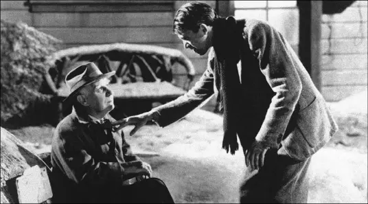  ?? The Associated Press ?? Henry Travers as Clarence the Angel, left, and Jimmy Stewart as George Bailey in the 1946 film “It’s a Wonderful Life.”