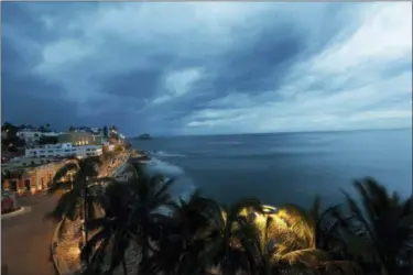  ?? MARCO UGARTE — THE ASSOCIATED PRESS ?? Clouds move in over Mazatlan, Mexico, Tuesday before the arrival of Hurricane Willa. Willa is headed toward a Tuesday afternoon collision with a stretch of Mexico’s Pacific coast, its strong winds and high waves threatenin­g high-rise resorts, surfing beaches and fishing villages.