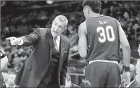  ?? AP/FRANK FRANKLIN ?? South Carolina coach Frank Martin (left) has the Gamecocks in the NCAA Men’s Final Four for the first time despite the team losing five of its last eight regular-season games.