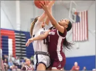  ?? MIKE CABREY — MEDIANEWS GROUP ?? Abington’s Cire Worley (1) puts up a shot as Plymouth Whitemarsh’s Erin Daley (15) contests during their District 1-6A playback on Saturday.