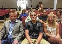  ?? CLAIRE OSBORN / AMERICAN-STATESMAN ?? Greg Kelley (center), with supporters Jake Brydon and Gaebri Anderson, told the council that his prosecutio­n “had very little to do with justice and truth.”