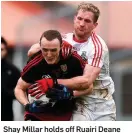  ??  ?? Shay Millar holds off Ruairi Deane