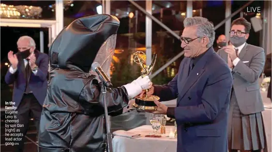  ?? EPA ?? In the family: Eugene Levy is cheered by son Dan (right) as he accepts lead actor gong