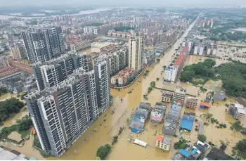  ?? GETTY IMAGES ?? Floodwater­s submerge Hanguang Town after heavy rainfall in Guangdong province.